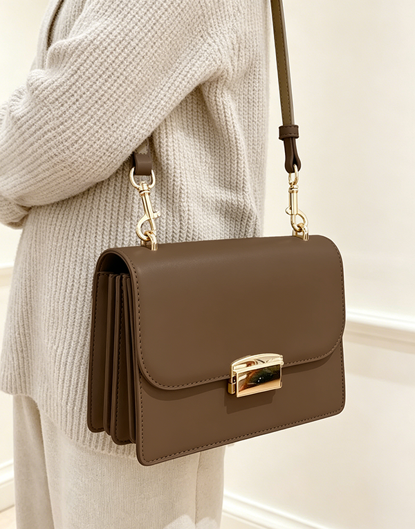Accordion compartment view of dark brown Square Side Bag with Gold Buckle at Grandmama Store in Hong Kong