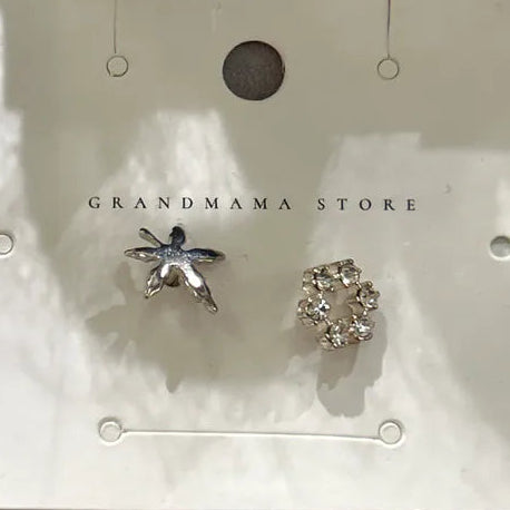 Asymmetrical silver starfish and rhinestone stud earrings at Grandmama Store in Hong Kong