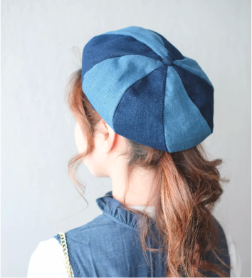 Back view of model wearing two-tone denim Sunshine Beret at Grandmama Store in Hong Kong