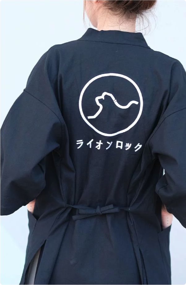 Back view of tied black Kamon Kimono Jacket-Lion Rock with white embroidery at Grandmama Store in Hong Kong