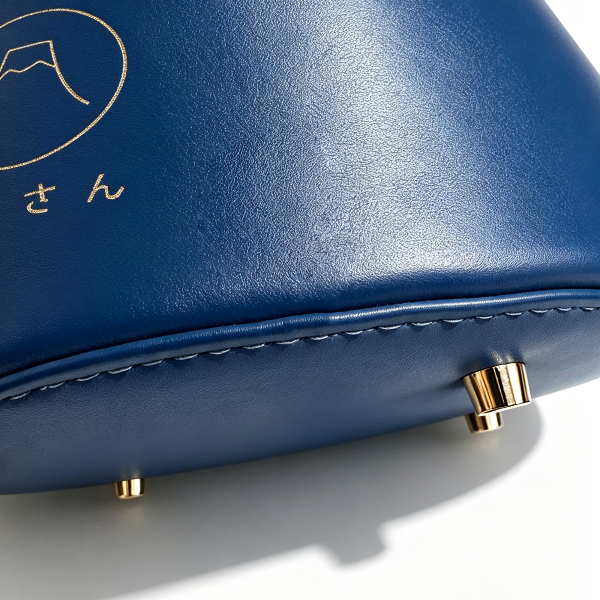 Base studs and gold foil logo on dark navy Mt. Fuji Goen Bag at Grandmama Store in Hong Kong