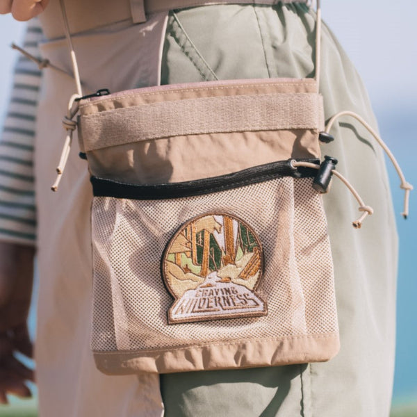 Brown Yama Multifunctional Bag featuring front mesh pocket and embroidered wilderness patch at Grandmama Store in Hong Kong.