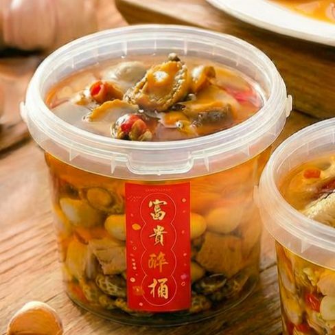 Clear bucket of Fortune Drunken Seafood Bucket with abalone and mixed shellfish at Grandmama Store in Hong Kong
