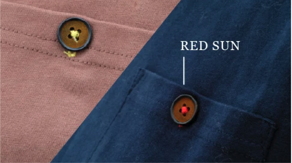 Close-up chest pocket button detail on brown Kamon Tee-Lion Rock at Grandmama Store in Hong Kong