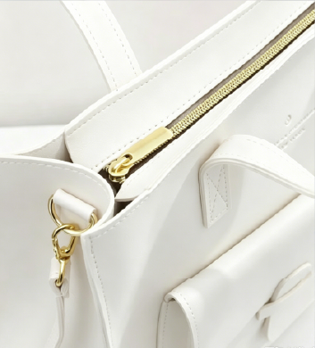 Close-up of premium metal zipper detail on off-white Vintage Soft Leather Convertible Bag at Grandmama Store in Hong Kong