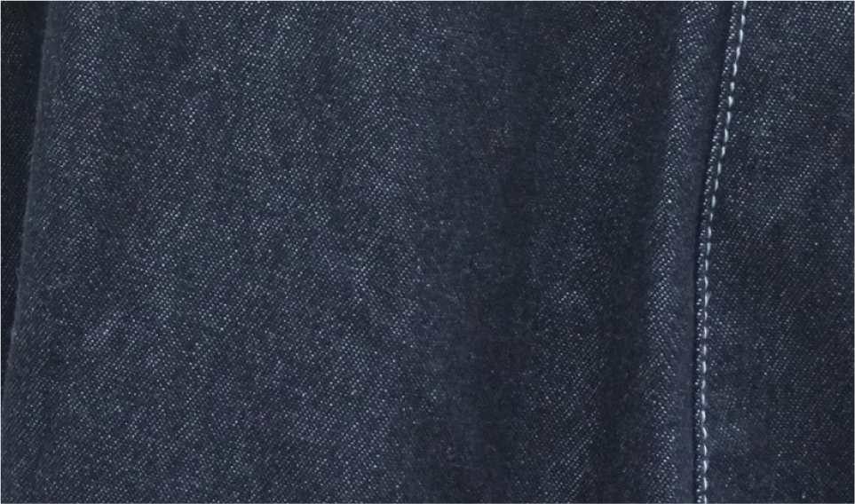Dark indigo denim fabric macro detail of Kamon Denim Dress at Grandmama Store in Hong Kong