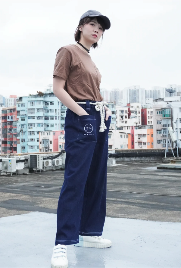 Female model posing in navy blue Kamon Japanese Waist Rope Pants-Lion Rock at Grandmama Store in Hong Kong