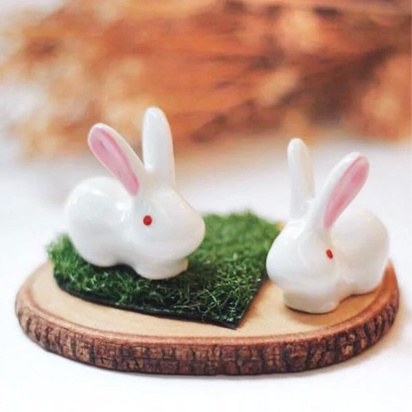 Frontal view of Little Rabbit Chopstick Rest pair on moss at Grandmama Store in Hong Kong