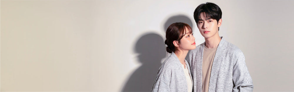 Male and female models wearing matching light grey Japanese kimono cardigans at Grandmama Store in Hong Kong.