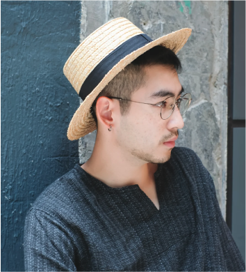 Male model wearing French Straw Boater Hat at Grandmama Store in Hong Kong