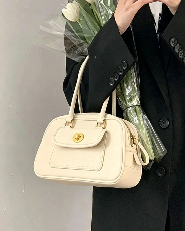 Model carrying off-white Minimalist Convertible Bag with tulips at Grandmama Store in Hong Kong