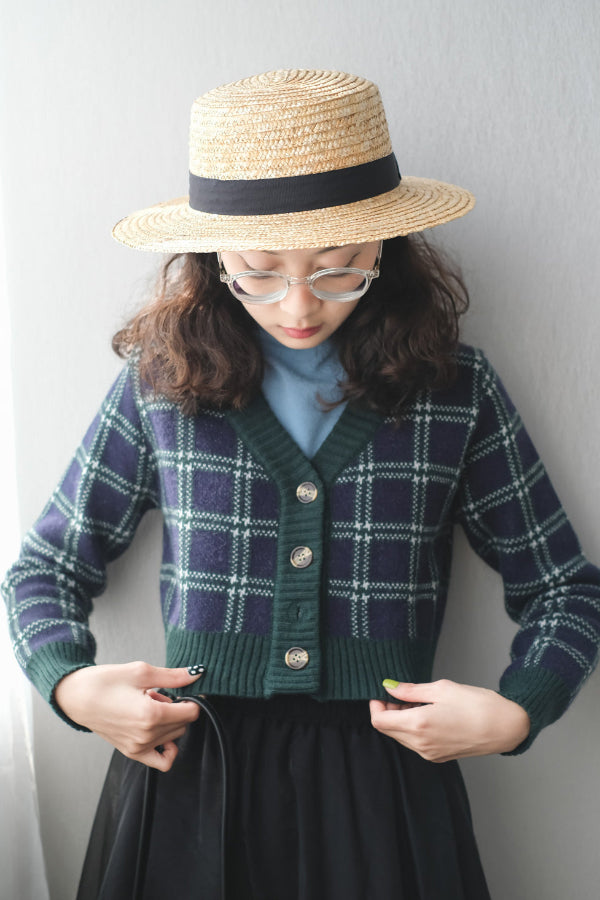 Model styled in plaid cardigan and French Straw Boater Hat at Grandmama Store in Hong Kong