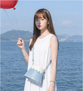 Model styled with Mt. Fuji Goen Bag in Light Blue cross-body style at Grandmama Store in Hong Kong