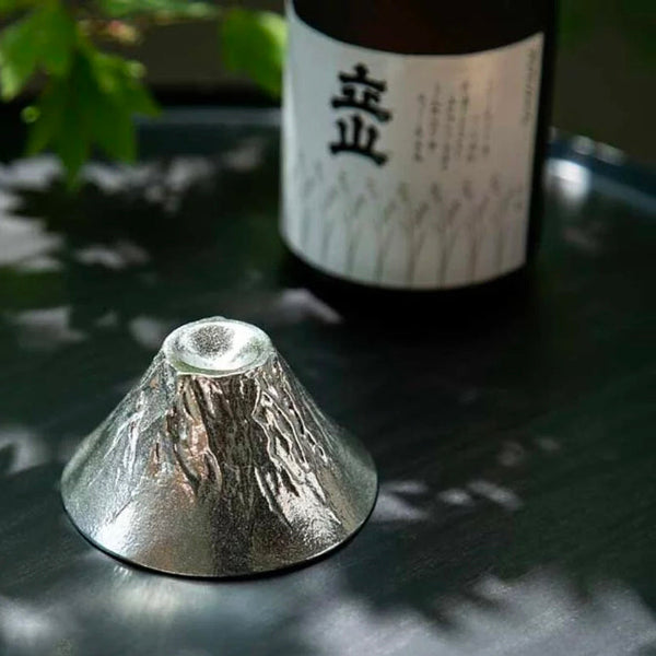 Mount Fuji Artisan Tin Sake Cup beside sake bottle at Grandmama Store in Hong Kong