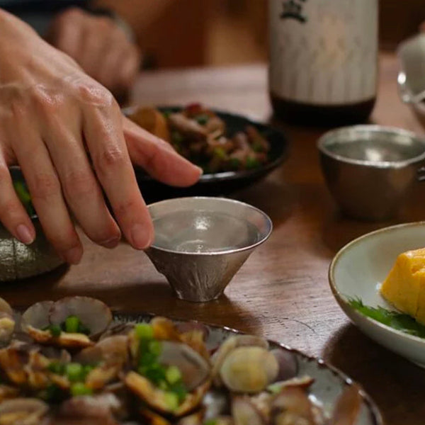 Mount Fuji Artisan Tin Sake Cup on a Japanese dining table at Grandmama Store in Hong Kong