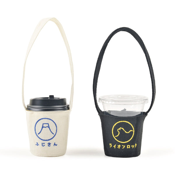 Off-white Mt. Fuji and black Lion Rock canvas Kamon Cup Sleeves side-by-side at Grandmama Store in Hong Kong.