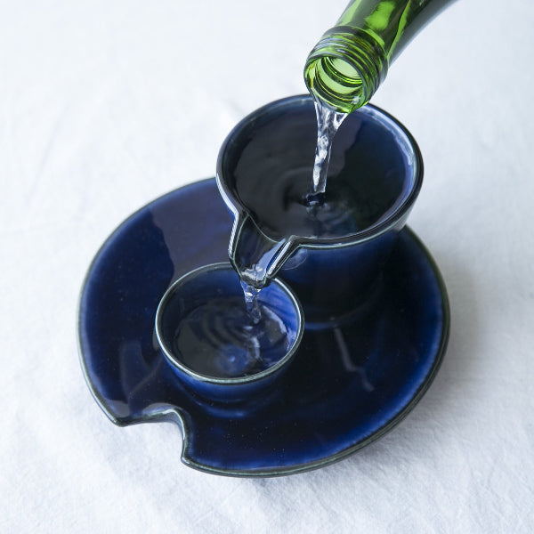 Pouring sake into the Kobyo Sizzle Cold Sake Serving Set at Grandmama Store in Hong Kong