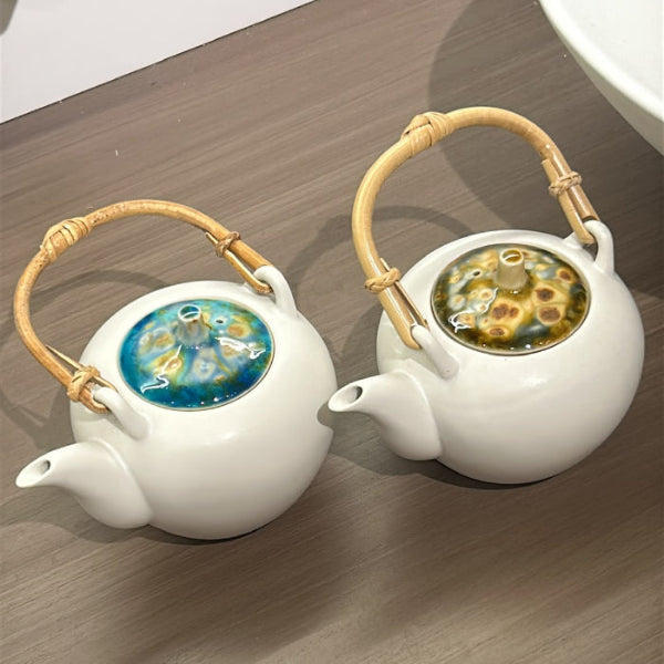 White ceramic Marbled clay teapots with bamboo handles at Grandmama Store in Hong Kong