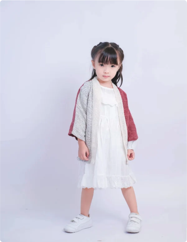 Young girl modeling Hand-cranked Kids Kimono in Crimson Red & Cream at Grandmama Store in Hong Kong