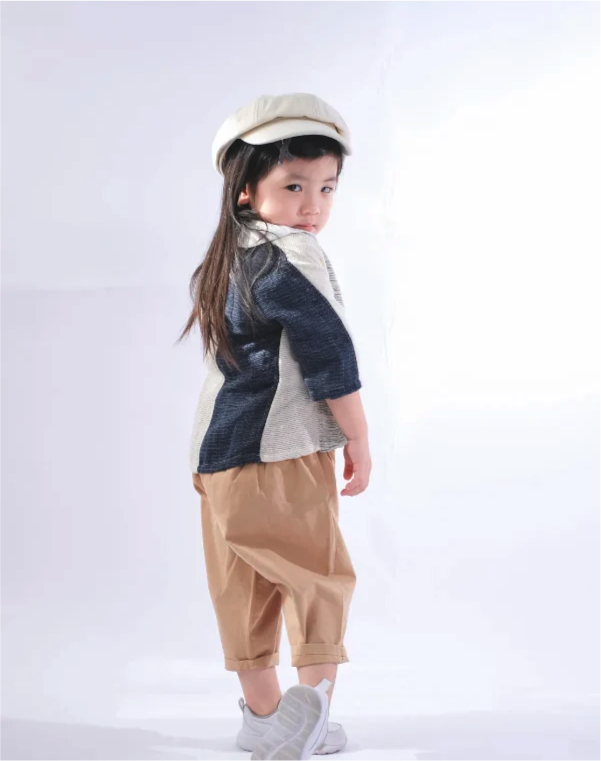 Young girl modeling Hand-cranked Kids Kimono in Indigo Blue & Off-White at Grandmama Store in Hong Kong