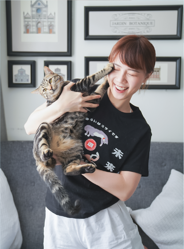 woman-holding-tabby-cat-up-wearing-black-lazy-cat-tee-Lazy-Cat-Tee-Hong-Kong-Kwun-Tong-Grandmama-store